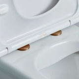 Lifestyle image of the Tavistock Brushed Bronze Wrap Over Toilet Seat Hinge Cover Caps